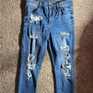 Blue Skinny Distressed Jeans with Tapered Legs